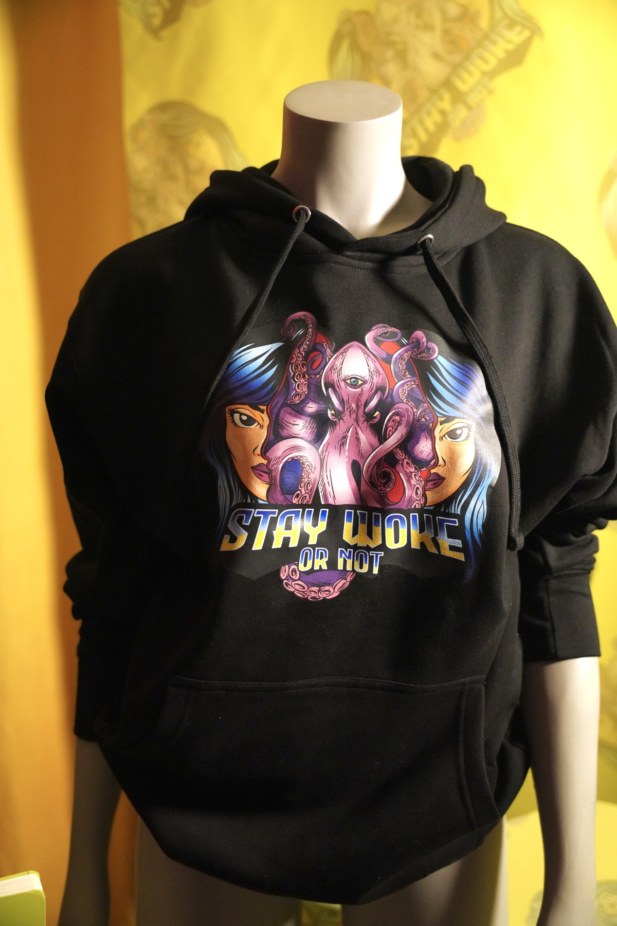 Black Stay Woke Or Not graphic hoodie on a mannequin